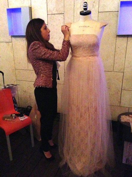 Ana puts finishing touches on her dress